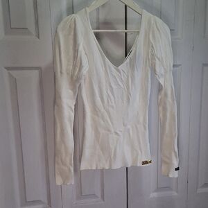 Baby Blue Elegant White V-Neck Sweater. Form Fitting , V-neck And Puff Shoulder.